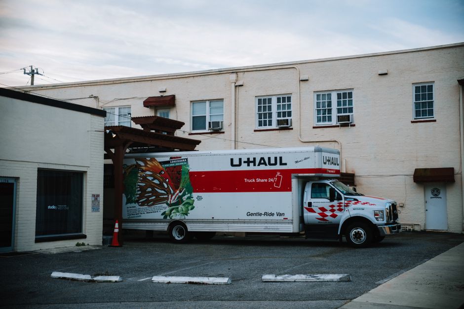 Moving team loading furniture into a moving truck